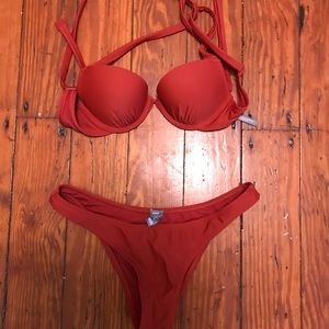Aerie small swimsuit in a warm brick red.